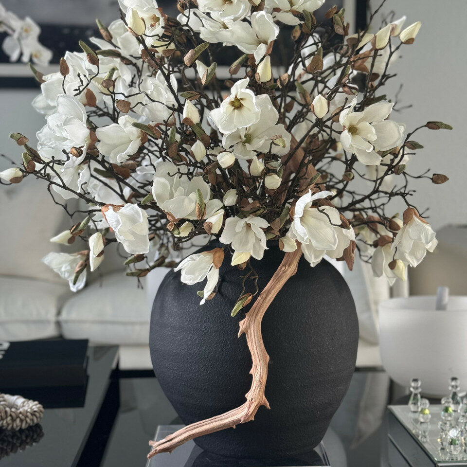 black konos vase with white magnolias