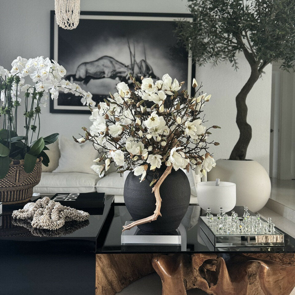 black konos vase with white magnolias